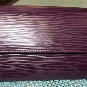 Louis Vuitton Epi Leather Sarah wallet in deep purple color